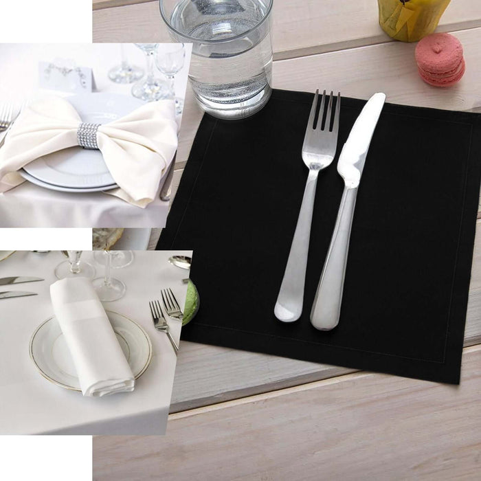 Elegant black placemat with silver cutlery on a wooden table.