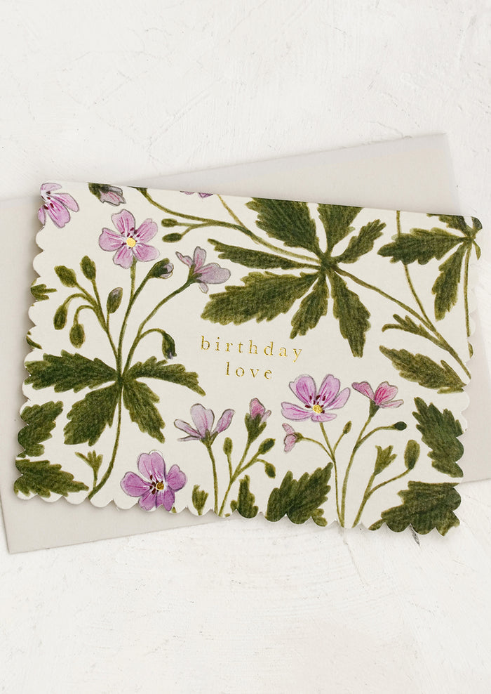 A geranium floral print card with text reading "Birthday love".