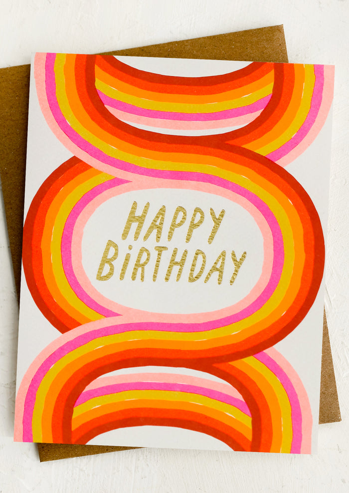 A birthday card with neon arches pattern.