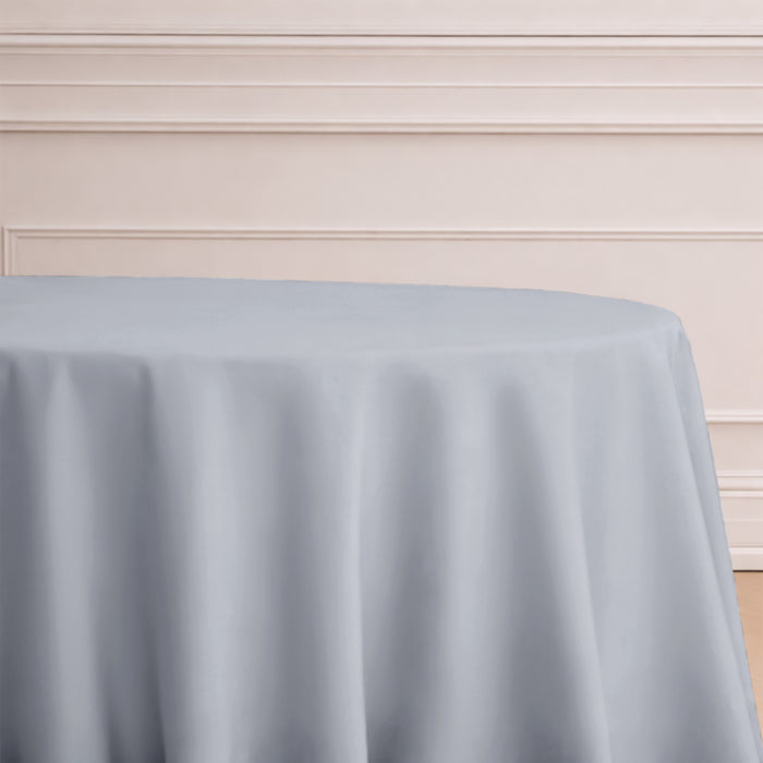 Gray tablecloth draped elegantly over a round table.