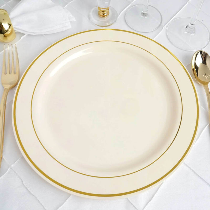 Elegant cream dinner plate with gold rim on a textured table setting.