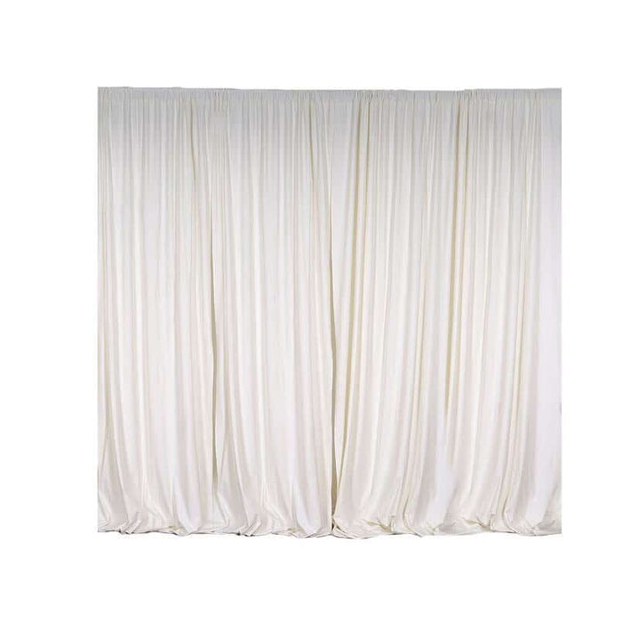 Elegant white drapery curtains on a plain backdrop