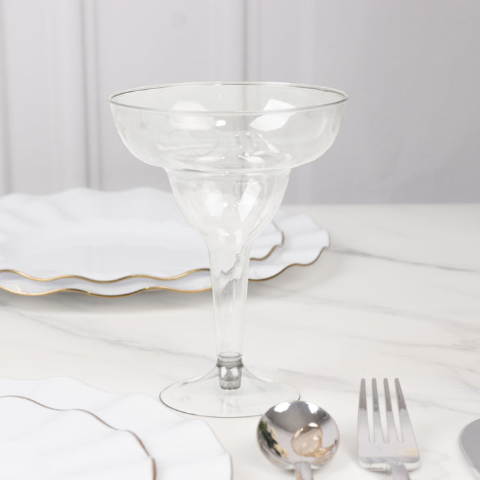 Clear glass dessert cup on a marble table with elegant white plates.