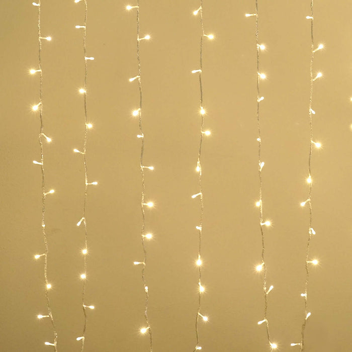 String lights hanging elegantly on a wall for festive decor.