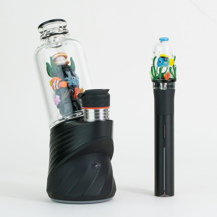 Save the Seas Puffco Peak glass attachment and matching Pivot mouthpiece displayed on Puffco device
