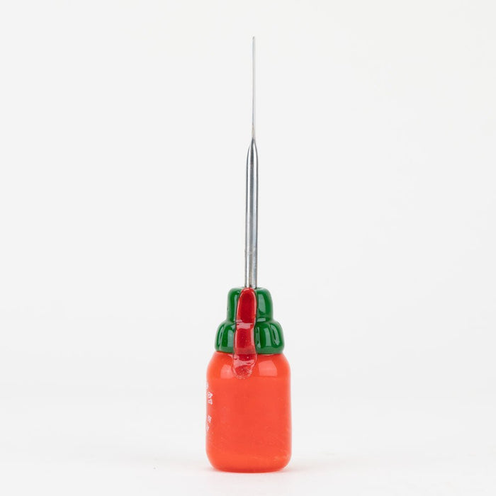 Empire Glassworks hot sauce dab tool with bottle-inspired glass artwork