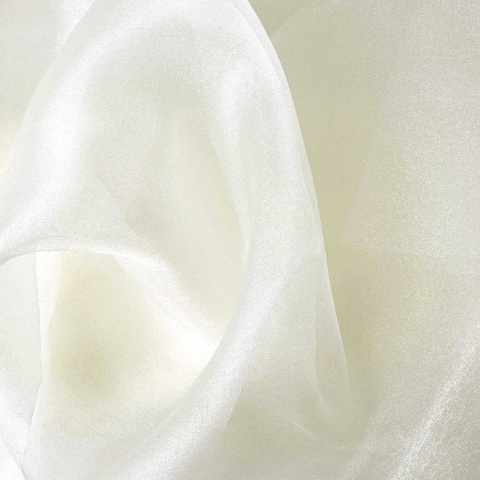 Sheer white fabric draped elegantly, showcasing its soft texture. #whtbkgd