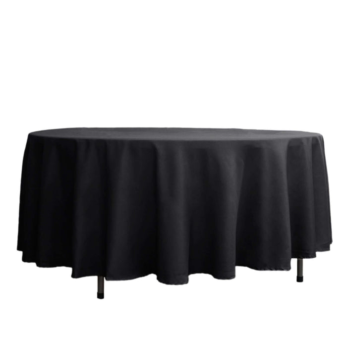 Black round tablecloth draping elegantly over a table