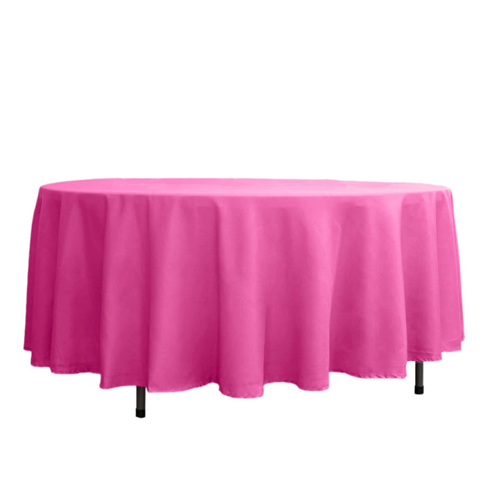 Pink tablecloth draped over an oval table.