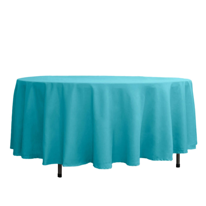 Turquoise round tablecloth draped elegantly over a table