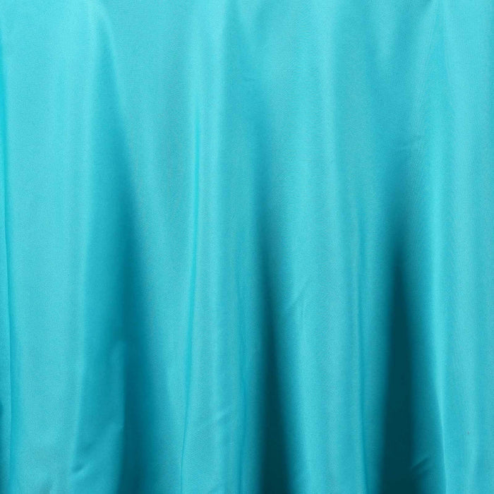 Smooth turquoise fabric texture with subtle draping.