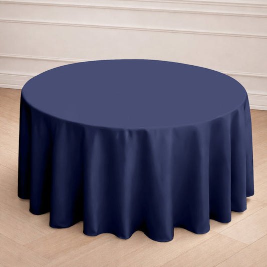 Navy round tablecloth draping a table in a stylish setting.