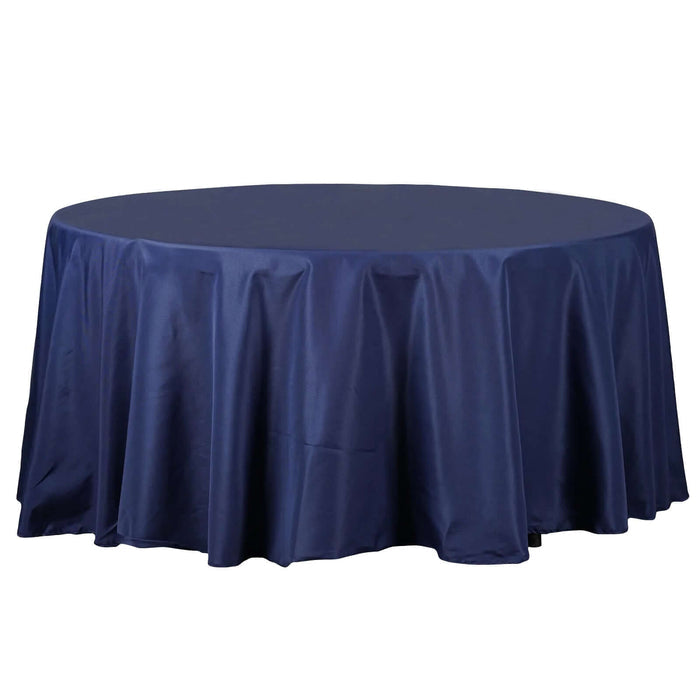 Round navy tablecloth with elegant draping.