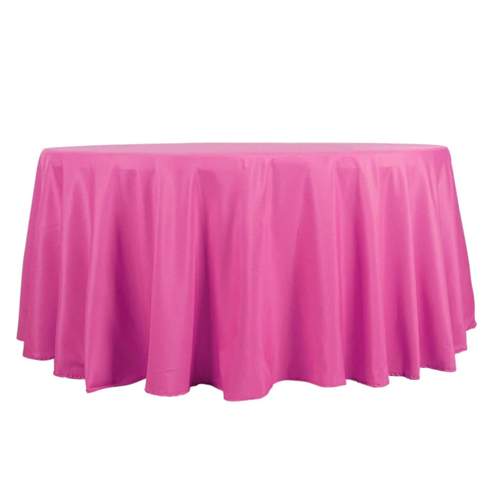 Pink round tablecloth with elegant draping fabric.