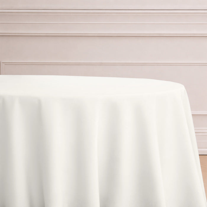 White tablecloth draped elegantly over a round table.