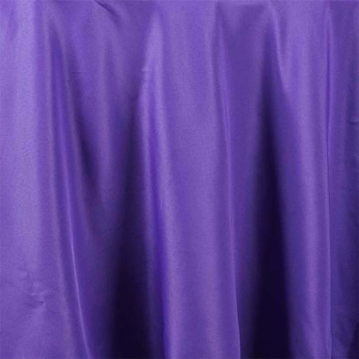 Purple satin fabric draped elegantly, showcasing its smooth texture.