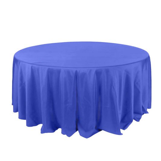 Round blue tablecloth draped elegantly over a table.