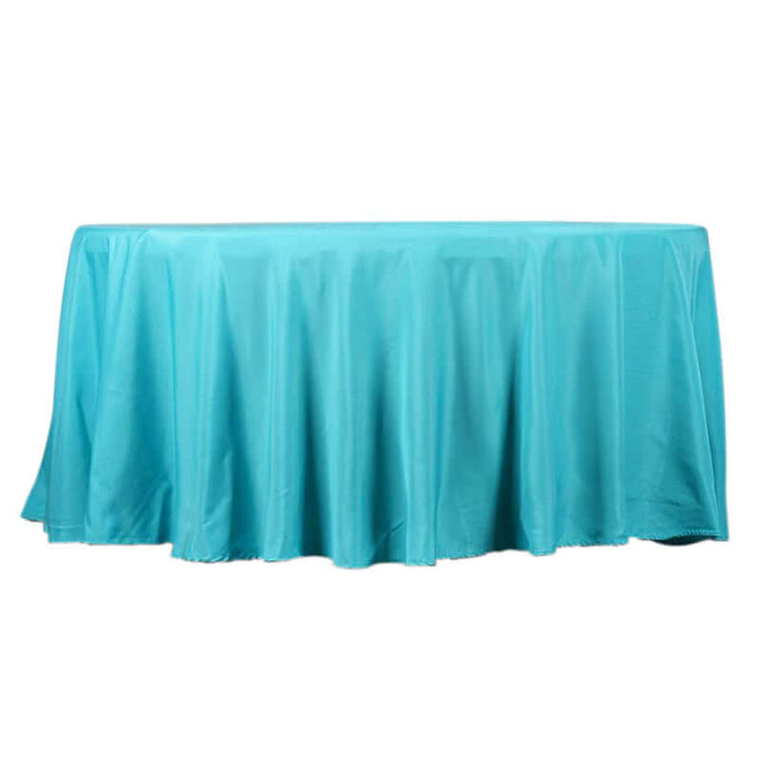 Turquoise tablecloth draped elegantly over a round table.