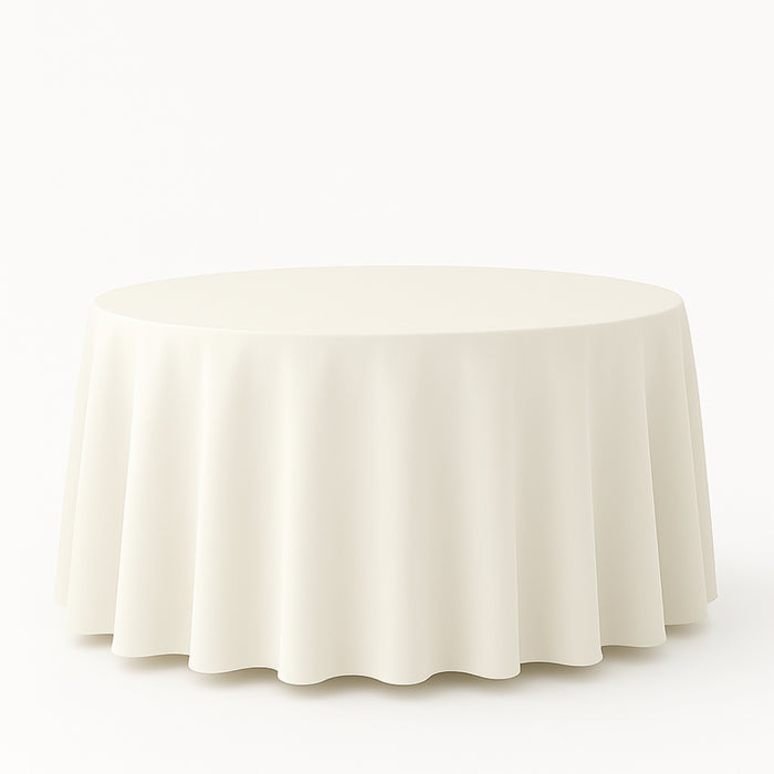 Round table with a soft, flowing tablecloth in neutral color
