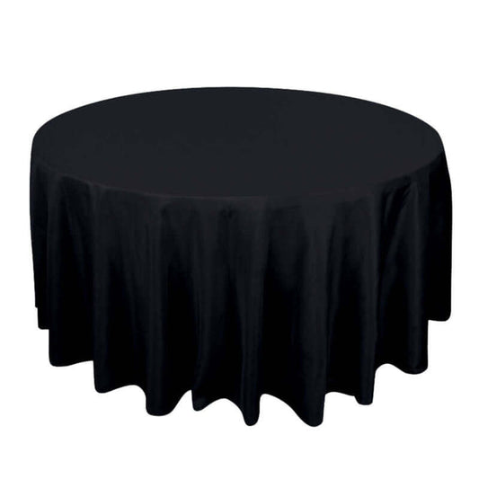 Round black tablecloth with elegant draping.