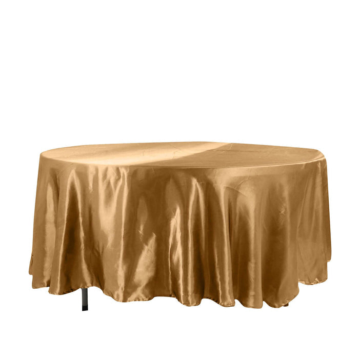 Gold satin tablecloth draping over an oval table