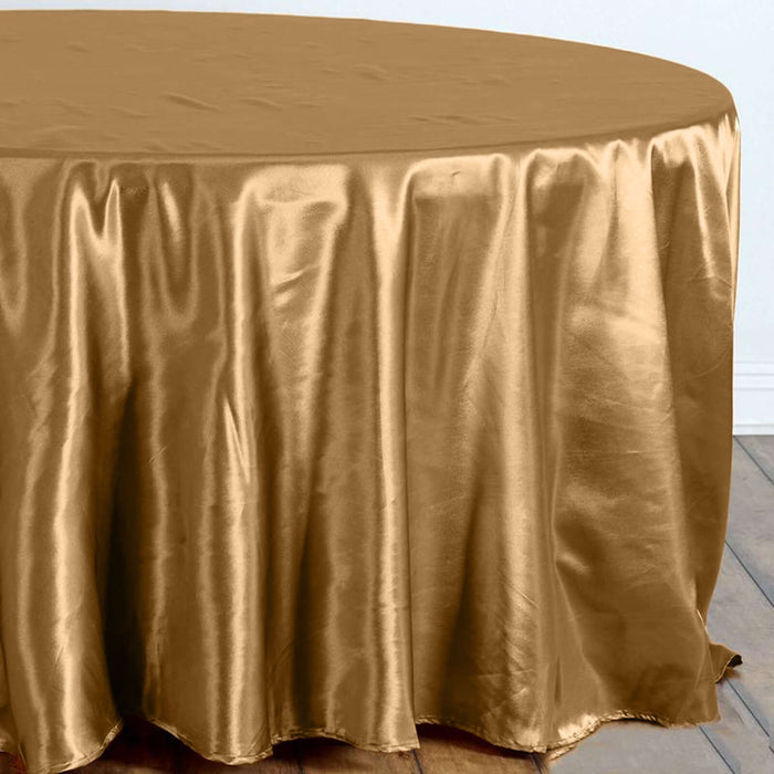 Gold satin tablecloth draping over a round table.
