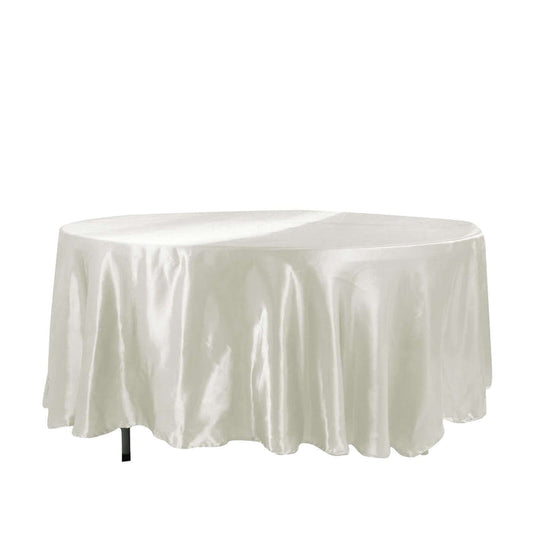 White round table covered with a satin tablecloth