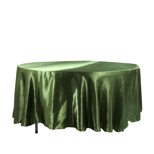 Green satin tablecloth draped over an oval table