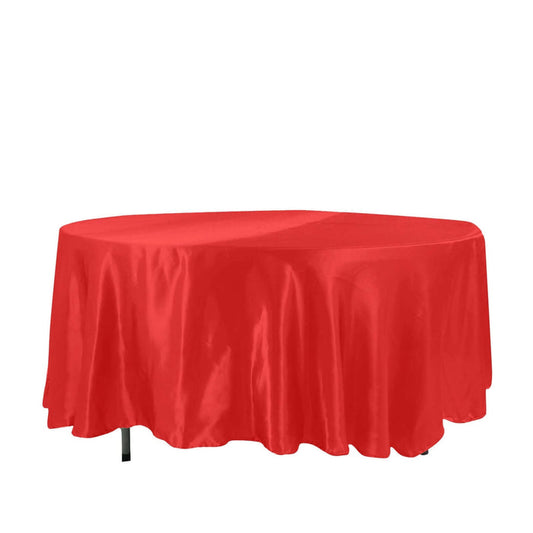 Red round tablecloth on a table.