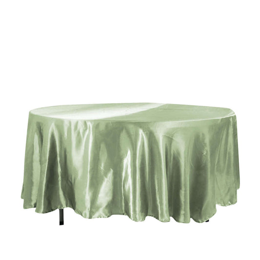 Green satin tablecloth draped elegantly over a round table