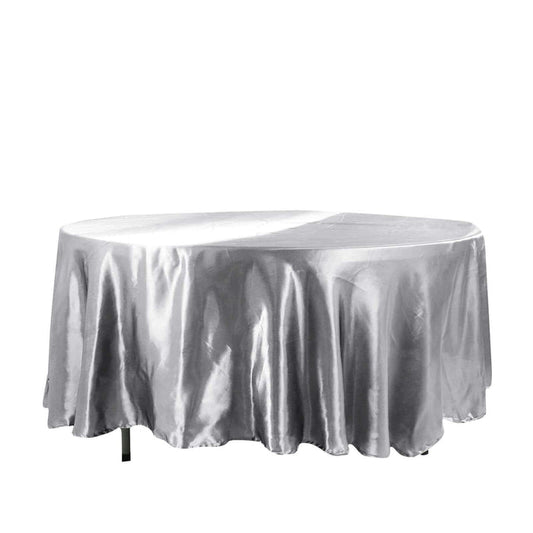Silver round tablecloth with elegant draping.