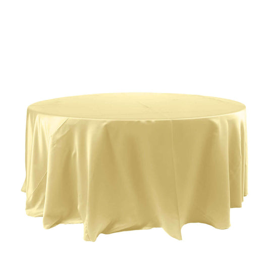 Round yellow tablecloth on a plain backdrop