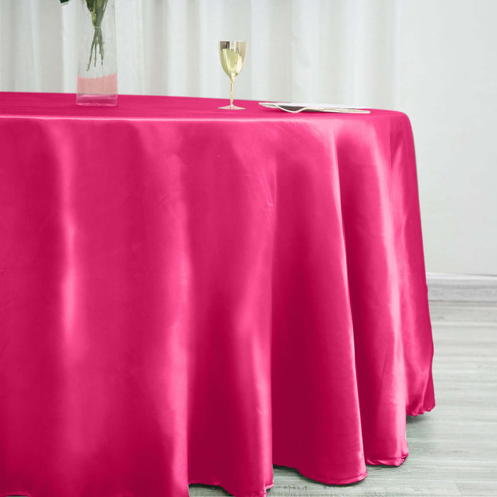 Pink satin tablecloth draping elegantly over a table.