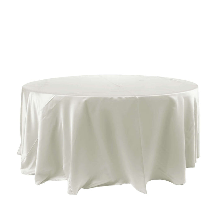 White round tablecloth made of satin fabric, elegantly draping over a circular table.