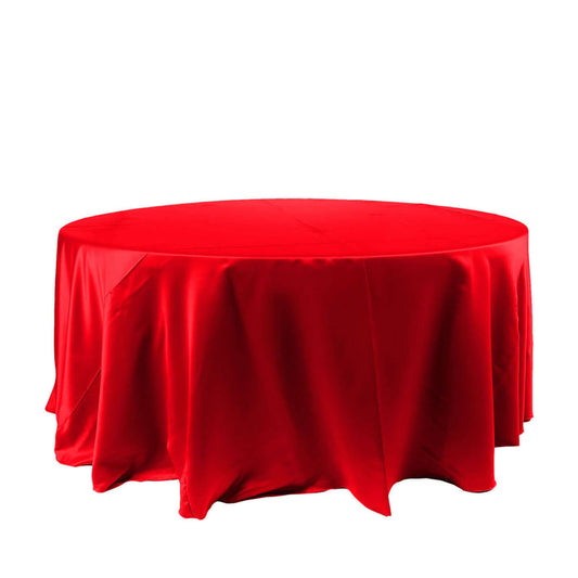 Red round tablecloth draped on a circular table