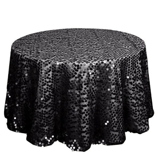 Black sequin tablecloth on a round table, perfect for elegant events.