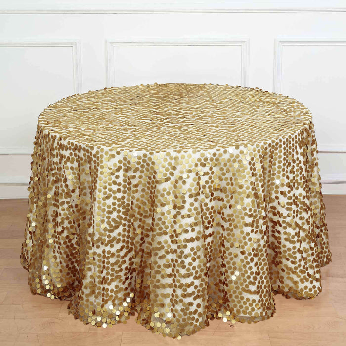 Gold sequin tablecloth with circular design on a wooden surface.